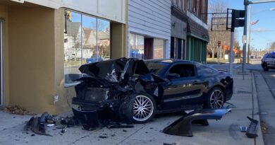 Car Crashes Into Parked Vehicle And Building