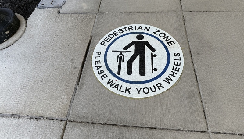 New Markings Remind People To Walk Their Wheels In Downtown District
